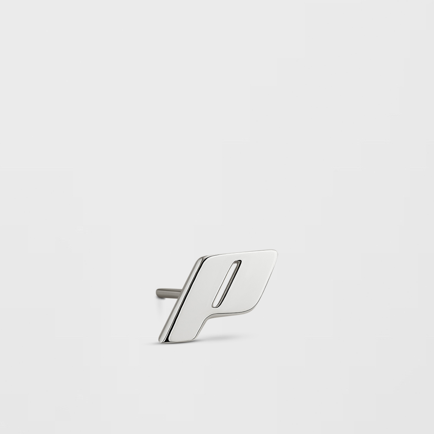 A single Play Stud earring in sterling silver with a monogram design, displayed against a Cloudstone Grey background.
