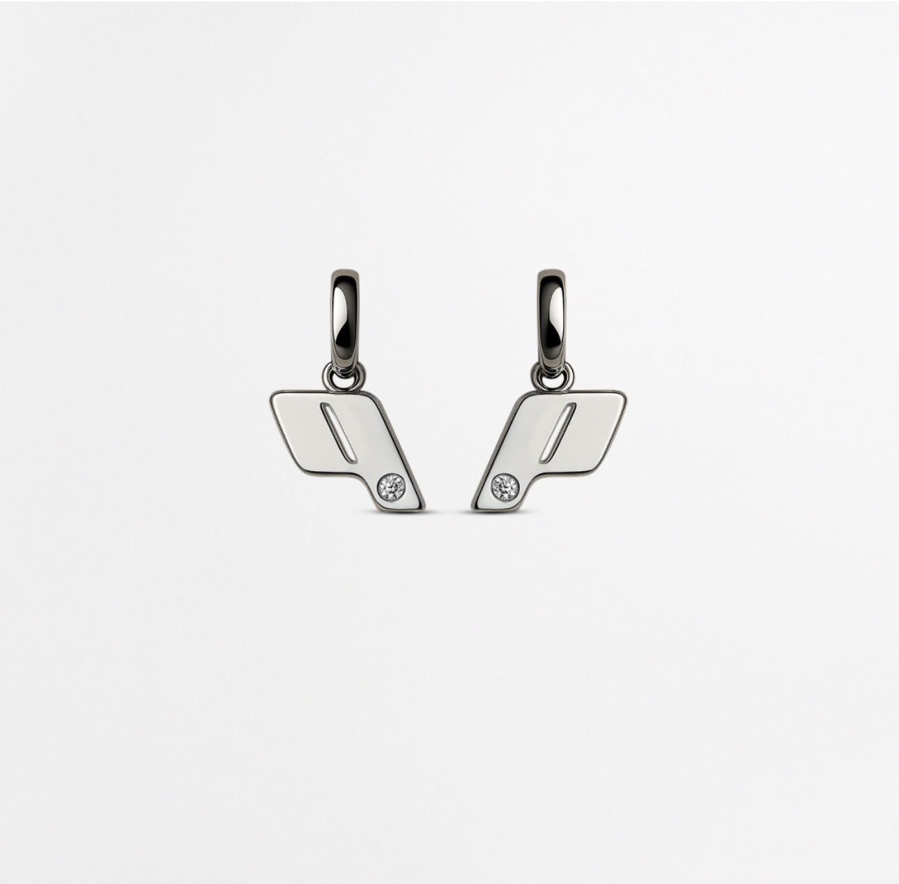 Front view of Play Drop earrings In Sterling Silver with natural diamond detail, photographed on a soft neutral background.