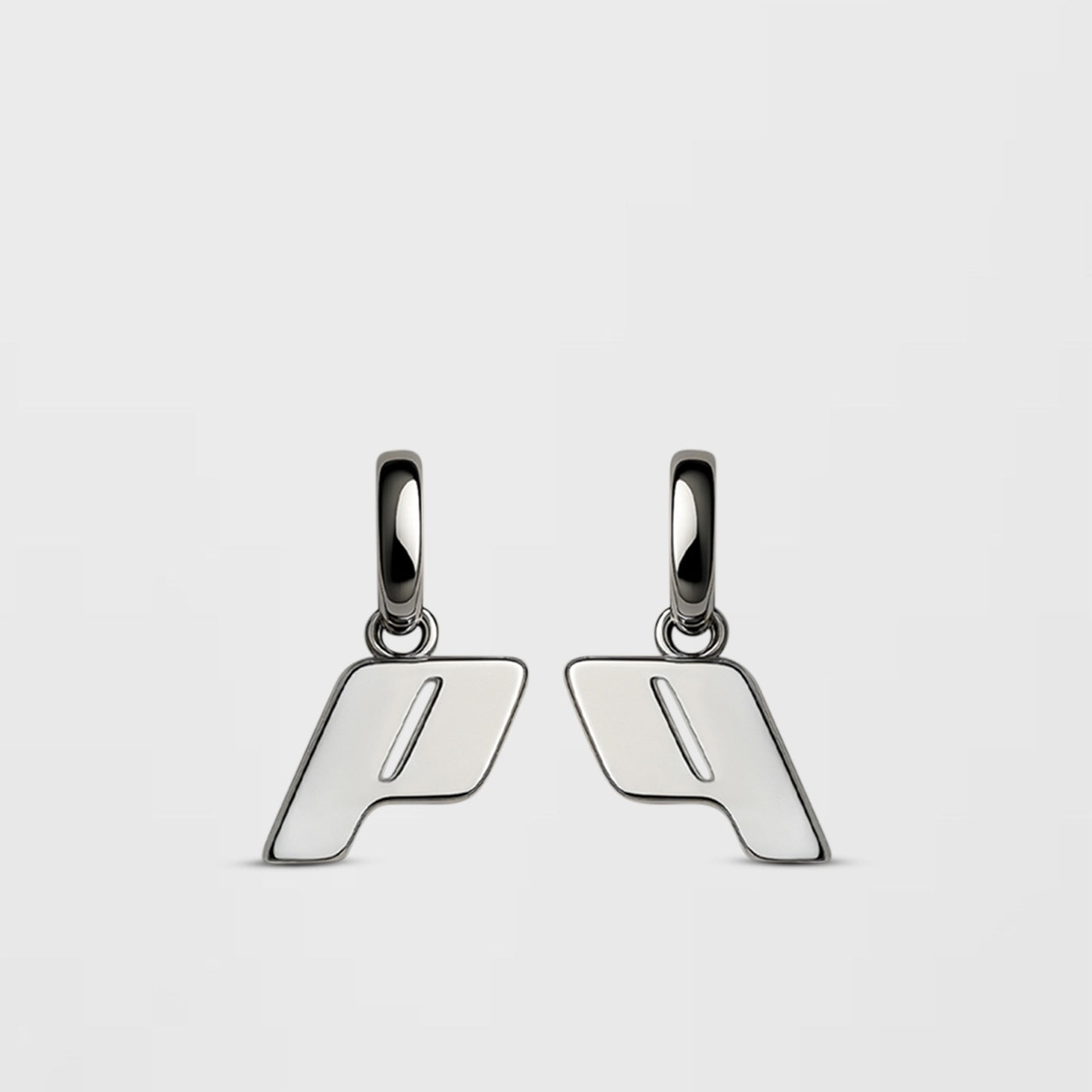 Play Drop earrings in Sterling silver, with a modern and minimalist design on a Cloudstone Grey background.