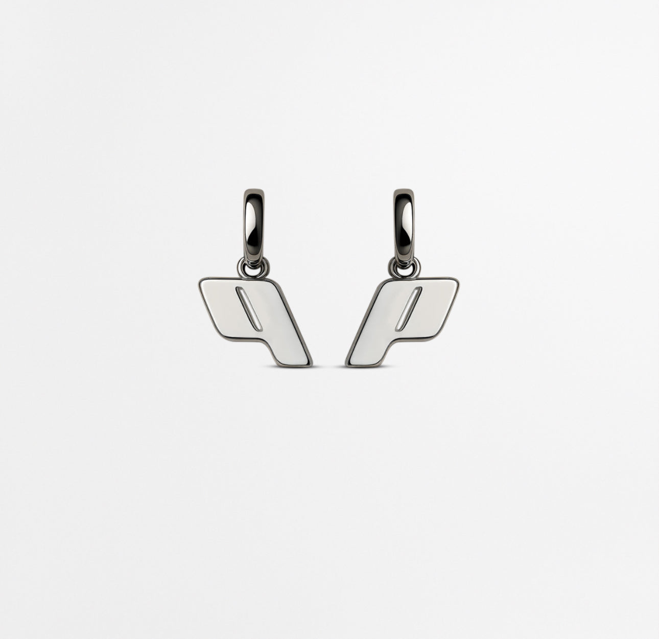 Play Monogram Drop earrings in Sterling silver with a modern and minimalist design set on a Cloudstone Grey background.