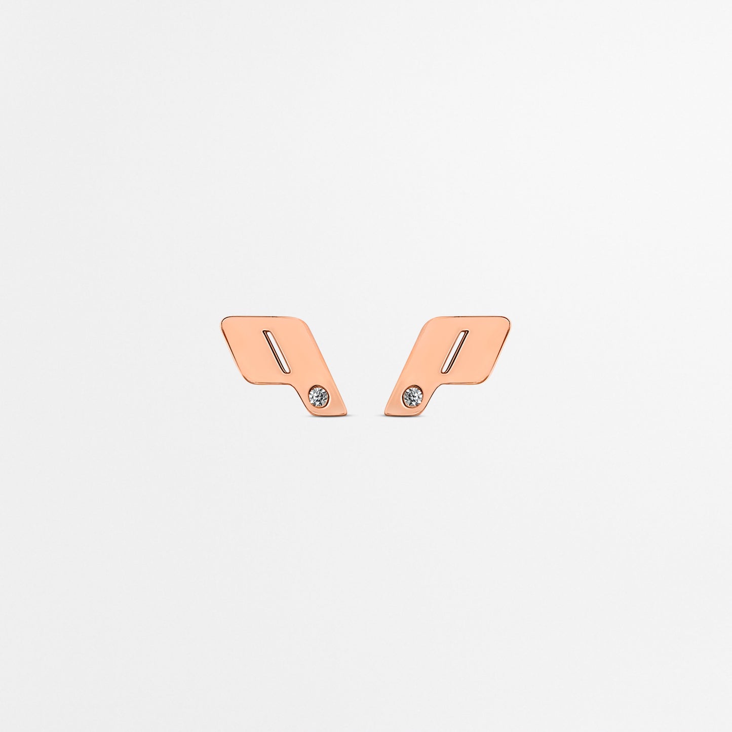 Front-facing view of Play's 18k rose gold monogram stud earrings, finished with natural VVS diamond accents on a clean white backdrop.