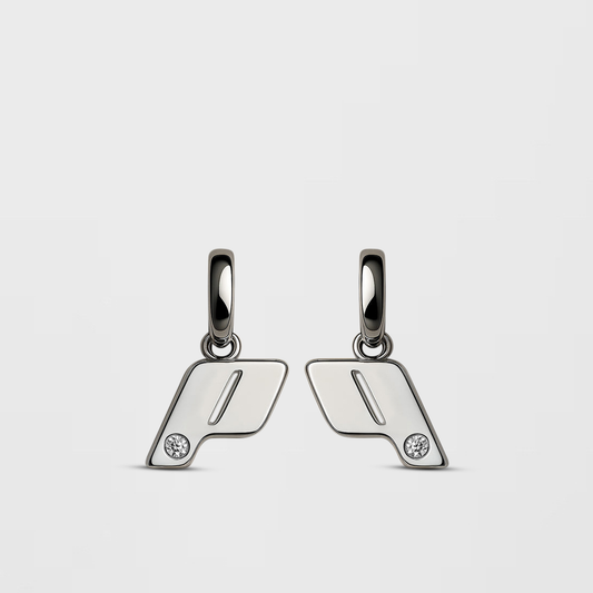 A pair of sterling silver drop earrings with a natural diamond detail, photgraphed on a Cloudstone Grey background. Part of the  OTR: On The Run collection.