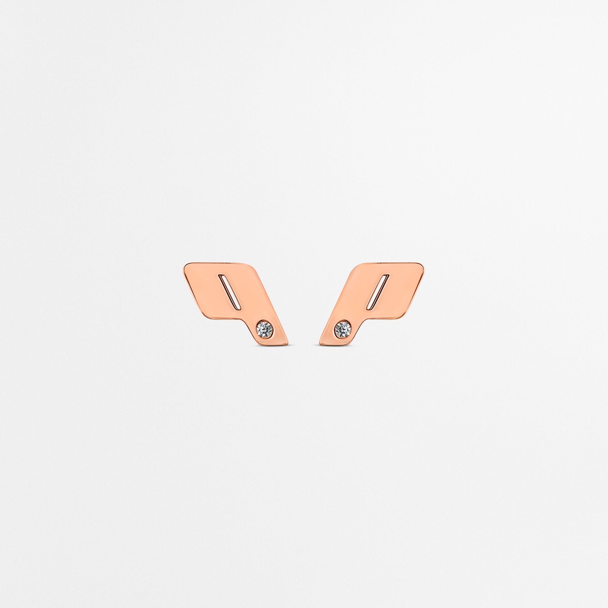 Front-facing view of Play's 18k rose gold monogram stud earrings, finished with natural VVS diamond accents on a clean white backdrop.